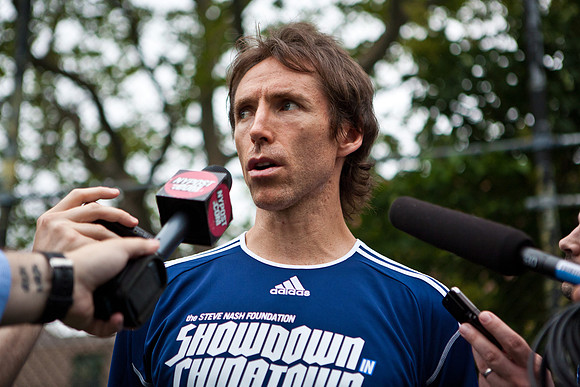 Steve Nash handles some mics